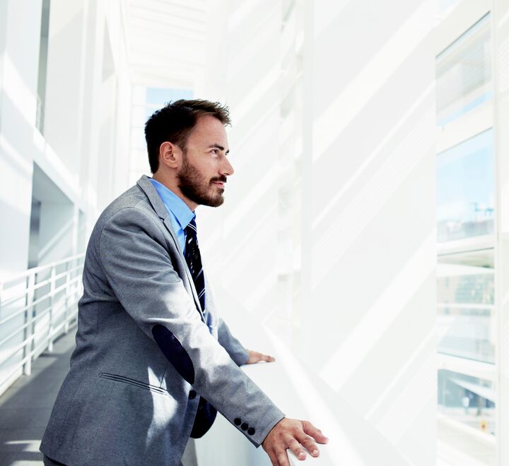 Man looking out a window